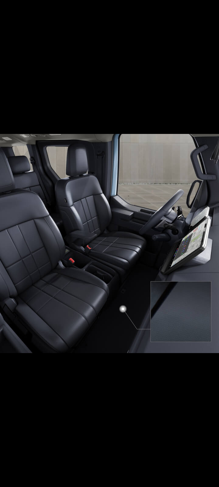 Innenansicht der Kabine des Kia PV5 Passenger mit Vorder- und Rücksitzen.
